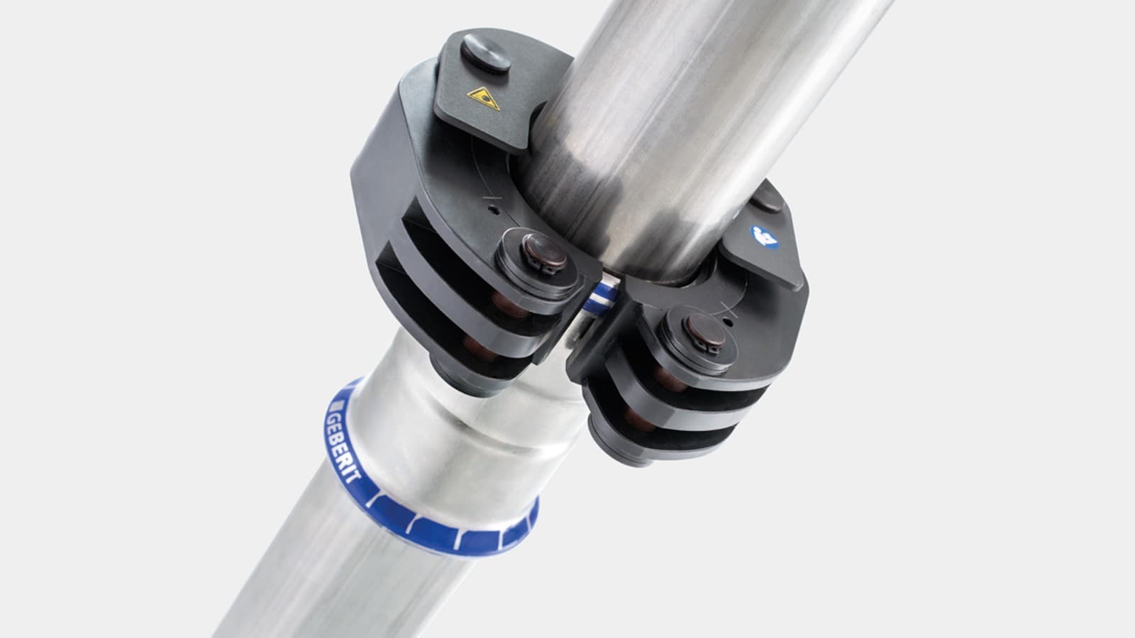 Skočni mehanizam fiksira obujmicu za stiskanje Geberit na fazonskom komadu Geberit Mapress Skočni mehanizam fiksira obujmicu za stiskanje Geberit na fazonskom komadu Geberit Mapress